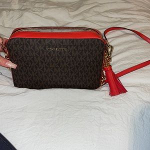 red and brown Michael Kors crossbody